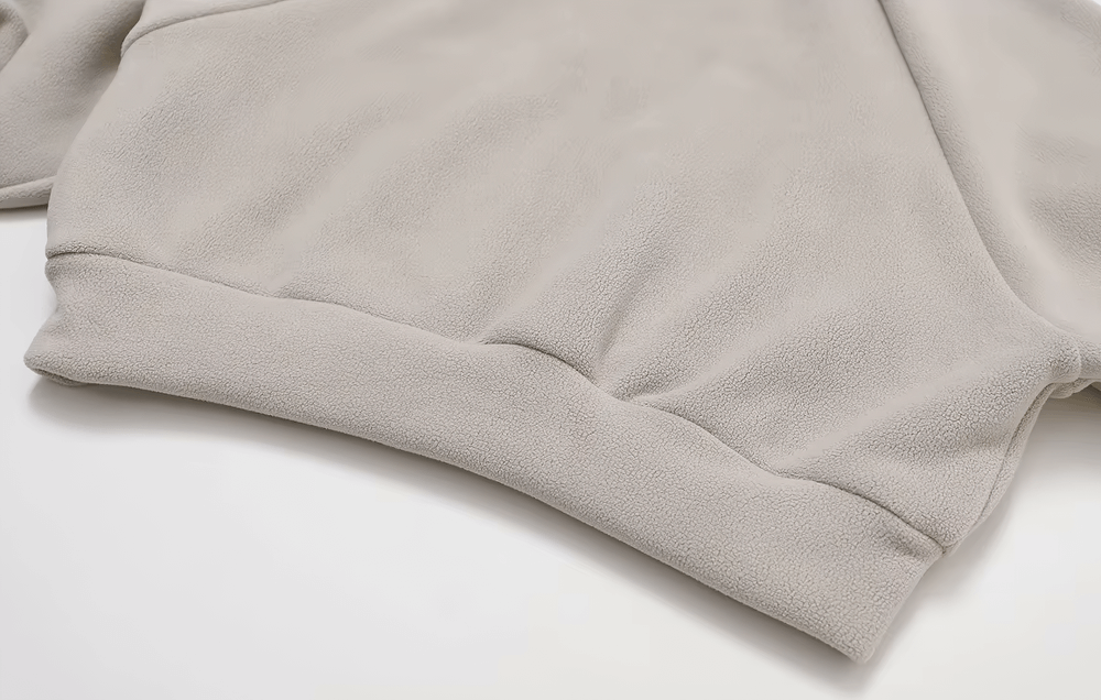 Close-up of a women's warm windproof winter jacket texture, showcasing soft fabric and secure stitching.